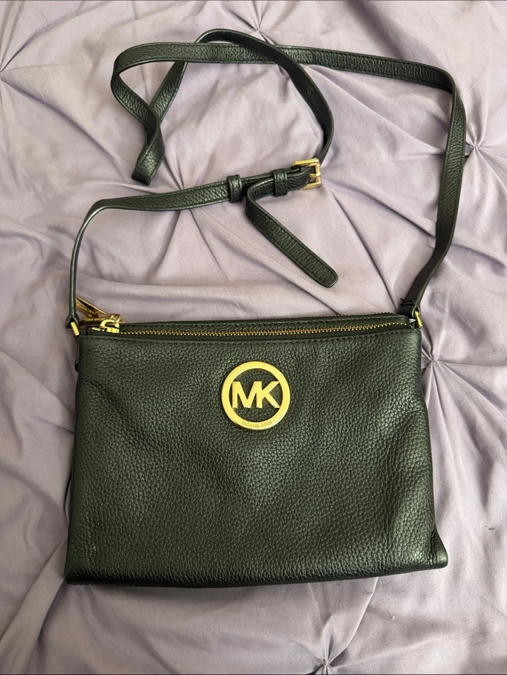 Michael Kors Black Pebbled Leather Crossbody with Gold MK Emblem.
